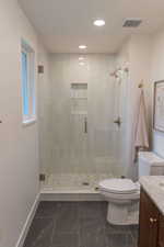 Full bath with vanity, a stall shower, and recessed lighting