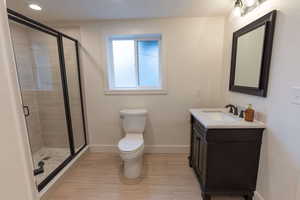 Bathroom featuring a stall shower and vanity