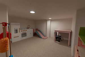 Game room featuring light carpet and recessed lighting
