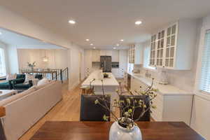 Dining space with light wood-style flooring and recessed lighting