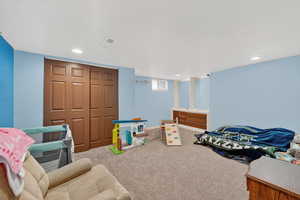 Playroom with carpet flooring, recessed lighting, and a textured ceiling