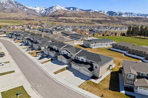 Aerial perspective of suburban area with a mountainous background