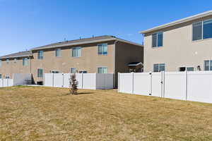 Rear view of house with stucco siding