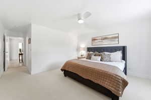 Bedroom with light carpet and ceiling fan