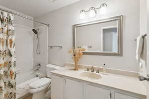 Full bath featuring vanity and shower / tub combo