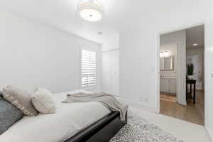 Bedroom featuring a closet and baseboards