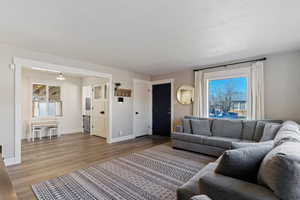 Living room with wood finished floors and baseboards