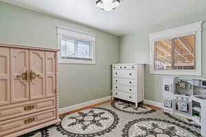Bedroom with baseboards and light wood-style flooring