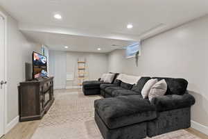 Living room featuring light wood-type flooring and recessed lighting