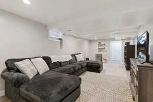 Living room with recessed lighting and baseboards