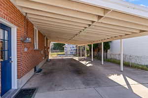 View of patio with an attached carport