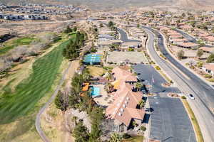 Aerial view of property's location featuring nearby suburban area