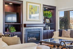 Living room with a glass covered fireplace