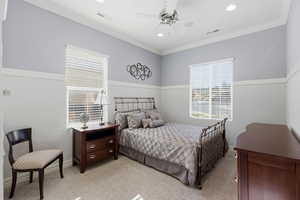 Bedroom with recessed lighting, light colored carpet, a ceiling fan, and crown molding