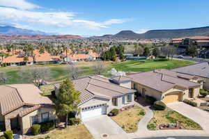 Aerial view of residential area featuring a mountain backdrop