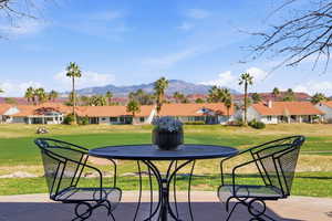 View of patio / terrace featuring a residential view and a mountain view