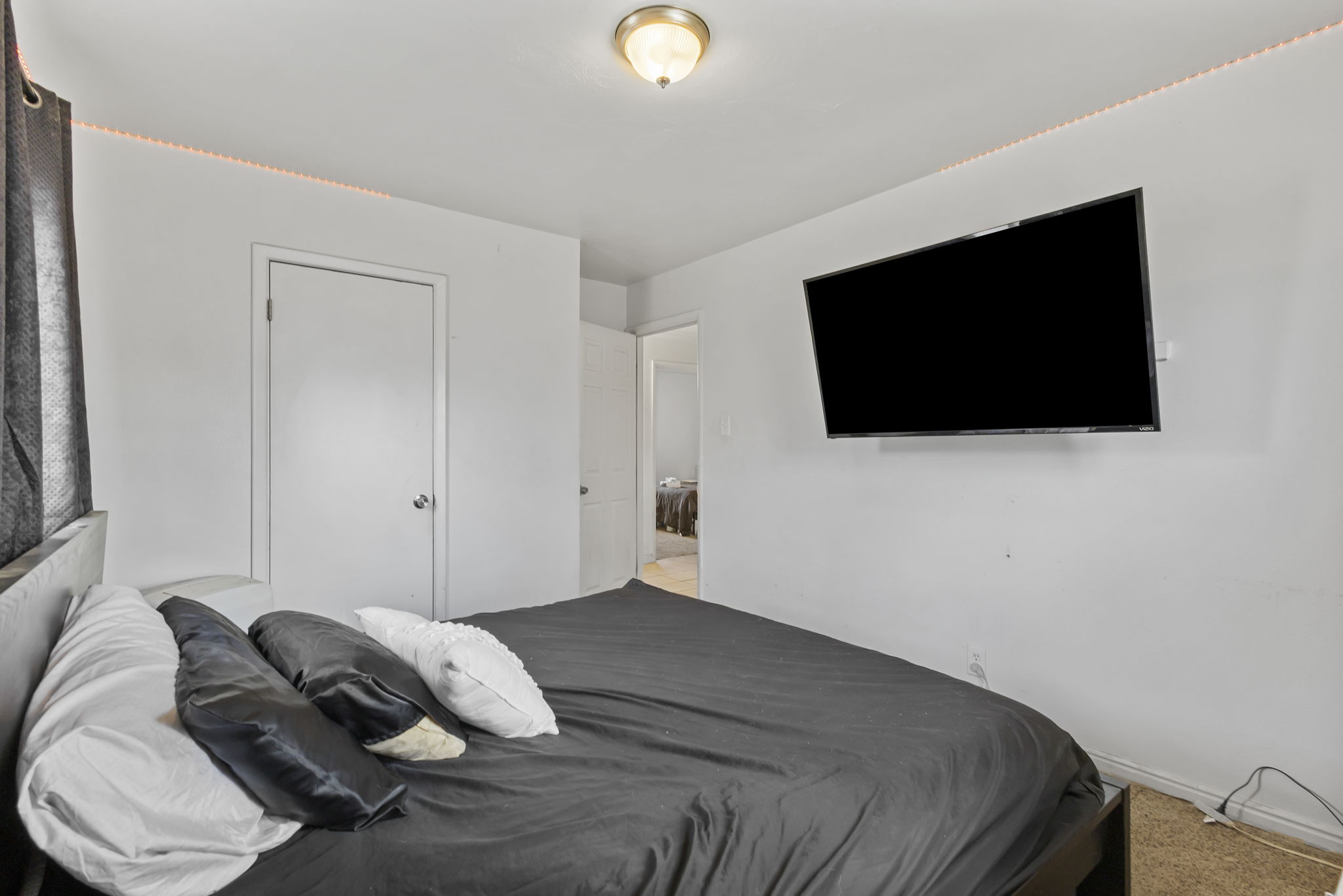 Bedroom featuring a closet and light carpet