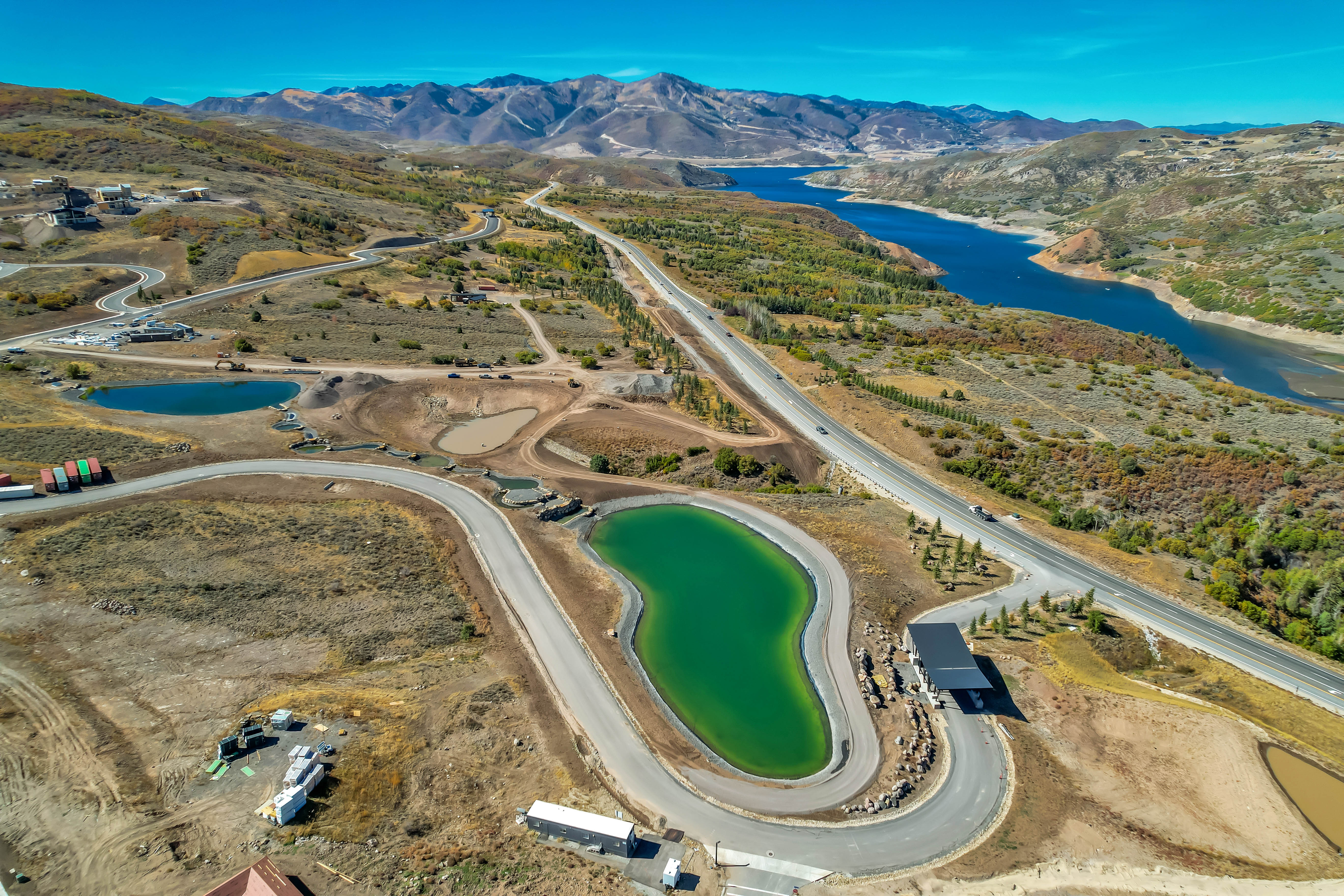Aerial view of property's location with a water and mountain view
