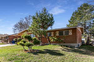 View of front of house with brick siding