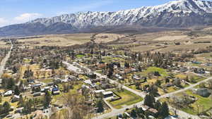 View of property location featuring nearby suburban area and a mountain backdrop