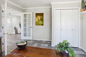 Entrance foyer featuring crown molding