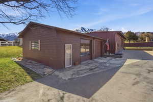Garage featuring a mountain view and driveway