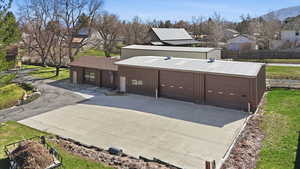 Garage with concrete driveway and a residential view