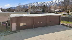 Exterior space with a mountain view and an outbuilding