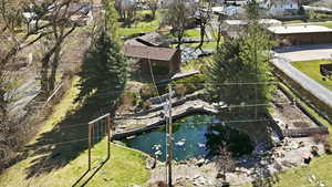 Aerial view of residential area with a garden pond