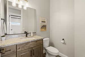 Bathroom featuring toilet and vanity