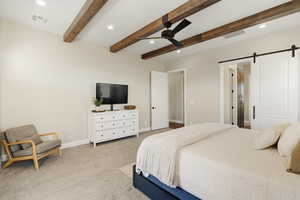 Bedroom with a barn door, recessed lighting, light colored carpet, ceiling fan, and beam ceiling