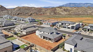 Aerial view of residential area with a mountain backdrop
