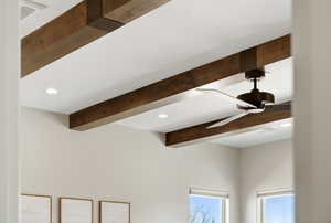 Detailed view of recessed lighting, beamed ceiling, and a ceiling fan