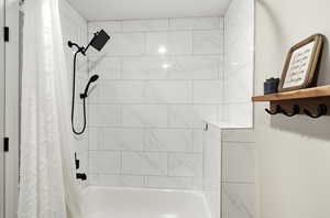 Full bathroom with shower / tub combo