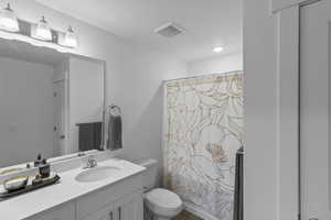 Bathroom with vanity and shower / bath combo