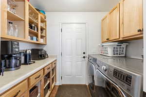 Laundry area with a textured ceiling and washing machine and dryer