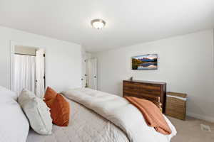 Bedroom with carpet and baseboards