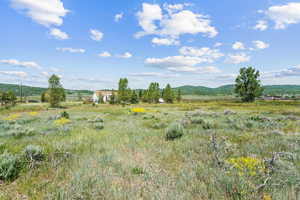 View of undeveloped land with rural landscape and mountains