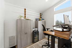 Office area with beverage cooler, vaulted ceiling, and recessed lighting