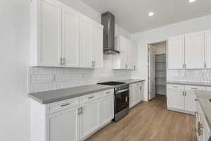 Kitchen with Gas range and direct venting hoodvent.