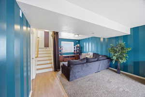 Living room featuring a textured ceiling and light wood-type flooring