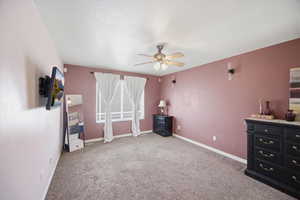 Unfurnished bedroom featuring light colored carpet and a ceiling fan
