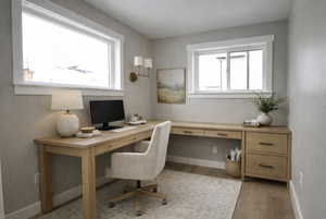 Virtually staged pocket office off of dining room