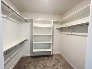 Walk in closet in primary bedroom