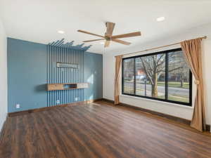 Spare room featuring dark wood-style floors, ceiling fan, and recessed lighting