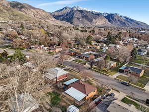 Aerial perspective of suburban area with a mountainous background
