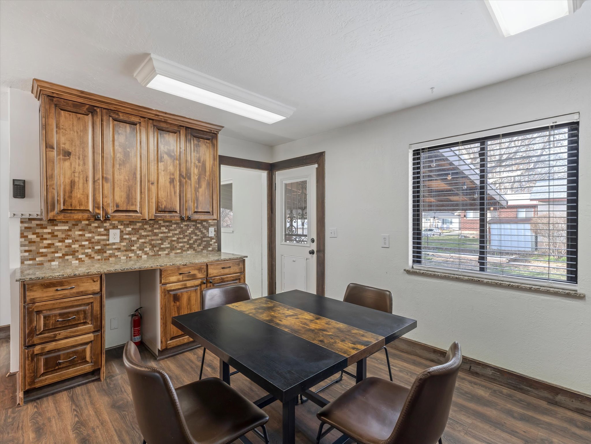 Kitchen with dark wood-type flooring