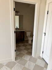 Bathroom featuring vanity and toilet