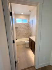 Full bathroom featuring vanity and shower / bath combination