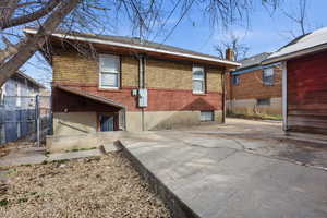 Rear view of house with brick siding
